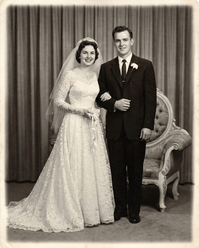A bride and groom posing together on their wedding day